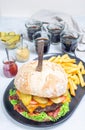 Huge giant homemade cheeseburger for burger party, vertical Royalty Free Stock Photo