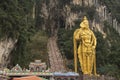 Huge gold hindu statue infront of Batu caves Royalty Free Stock Photo