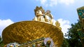 Huge golden buddha with blue sky background in the three buddhas park, Amideva Buddha Park