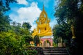 A huge golden Buddha statue on the territory of the temple in Phatthalung in Thailand