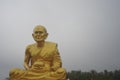 Huge golden Buddhist monk statue