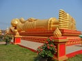 Huge Golden Reclining Buddha Image at Wat That Luang Tai Temple, Part of PhaThat Luang in Vientiane, Laos