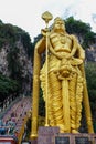 A huge golden sculpture of the Indian god at the entrance to the caves