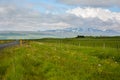 Huge green empty field with view to mountain Royalty Free Stock Photo