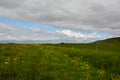 Huge green empty field with view to mountain Royalty Free Stock Photo