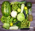 Huge group of fresh green fruit and vegetables on wood background - Concept of healthy green food Royalty Free Stock Photo