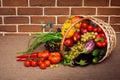 Huge group of fresh vegetables and fruits in wicker basket Royalty Free Stock Photo