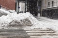 Huge heap of dirty snow and ice on a city street