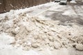 Huge heap of dirty snow and ice on a city street