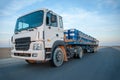 Huge heavy-duty truck on the empty road