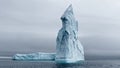 A huge high breakaway glacier drifts in the southern ocean off the coast of Antarctica at sunset, the Antarctic