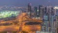 Huge highway crossroad junction between JLT district and Dubai Marina aerial day to night timelapse.