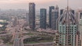 Huge highway crossroad junction between JLT district and Dubai Marina night to day timelapse.