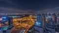 Huge highway crossroad junction between JLT district and Dubai Marina all night timelapse.