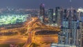 Huge highway crossroad junction between JLT district and Dubai Marina aerial day to night timelapse.