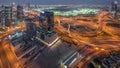 Huge highway crossroad junction between JLT district and media city aerial day to night timelapse.