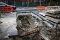 Huge hole in the ground made by the city hall workers to change hot water pipes from the Bucharest`s thermal energy distributor Royalty Free Stock Photo