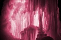 Huge ice icicles. Large blocks of ice frozen water. Blue ice background. Image toned in Viva Magenta, color of the 2023