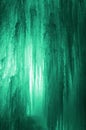 Huge ice icicles. Large blocks of ice frozen waterfall or water. Light green ice background. Frozen stream waterfal Royalty Free Stock Photo