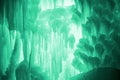 Huge ice icicles. Large blocks of ice frozen waterfall or water. Light green ice background. Frozen stream waterfal Royalty Free Stock Photo