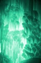 Huge ice icicles. Large blocks of ice frozen waterfall or water. Light green ice background. Frozen stream waterfal Royalty Free Stock Photo