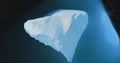 Huge iceberg in blue water aerial top down view