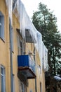 Huge icicles hanging over the balcony of a residential building