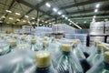 huge industrial warehouse with plastic food wrap wrapped plastic bottles with carbonated drinks, water or beer. Royalty Free Stock Photo