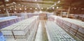 huge industrial warehouse with plastic food wrap wrapped plastic bottles with carbonated drinks, water or beer. Royalty Free Stock Photo