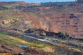 Huge iron ore quarry with working dump trucks and excavators in Kryvyi Rih, Ukraine Royalty Free Stock Photo