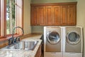 Huge laundry room with white washer and dryer Royalty Free Stock Photo