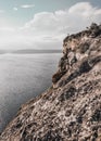 Huge light stone rocks Above a wide spacious clean lake under the sun