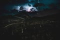 Huge lightning bolt during nightly thunderstorm in the Dolomites Royalty Free Stock Photo