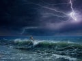 Huge lightning in dark sky above stormy sea
