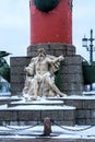 Russia, St. Petersburg, January 2021. The figure of Neptune at the foot of the red column.