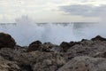 Huge mass of water hit a rocky cliff. The crazy Mediterranean sea rustles and attacks all the rocks and wants to get out of his Royalty Free Stock Photo