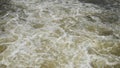 Huge mass of water in whirlpools. Gusting water of Elbe river under weir in Podebrady town.