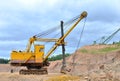 Huge mining excavator in the limestone open-pit.