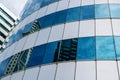 huge mirrored windows of a business center with reflections. Modern Business Building Royalty Free Stock Photo