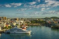 Huge motor boat in the port of Pointe-a-Pitre, with beautiful city on background Guadeloupe Royalty Free Stock Photo