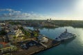 Huge motor boat in the port of Pointe-a-Pitre, with beautiful city on background Guadeloupe Royalty Free Stock Photo