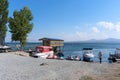 Armenia, Lake Sevan, September 2021. View of the lake shore with boats and jet skis by the water.