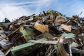 Huge mountain of metal pieces of different origin accumulated in a scrap yard Royalty Free Stock Photo