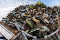 Huge mountain of metal pieces of different origin accumulated in a scrap yard Royalty Free Stock Photo
