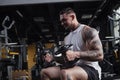 Huge muscular man training at bodybuilding gym Royalty Free Stock Photo