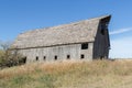 Huge old abandoned barn on a hillside