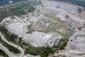 Huge open-pit granite quarry, view from drone, cloudy day