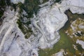 Huge open-pit granite quarry, view from drone, cloudy day