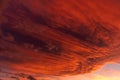 Huge orange cloud in the sky at sunset