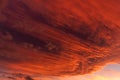 Huge orange cloud in the sky at sunset